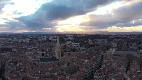 Amazing-cloudy-sunset-over-Montpellier-Ecusson-aerial-drone-view,-park-Peyrou